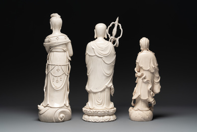 Three Chinese Dehua blanc de Chine figures of Guanyin and a monk, He Chaozong 何朝宗 and Dehua 德化 mark, 20th C.