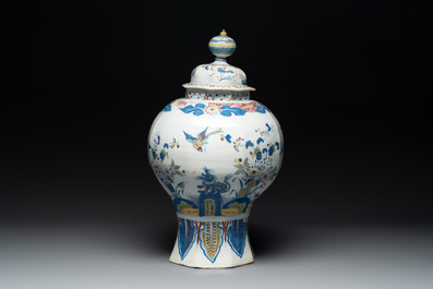 A large polychrome Dutch Delft baluster vase and cover, late 17th C.