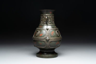 A Chinese archaistic gold- and silver-inlaid bronze vase with pseudo-rust patina, 19th C.
