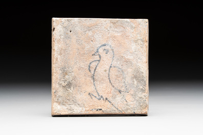 A fine polychrome Dutch Delft maiolica 'bird' diamond tile with a trial drawing on the back, late 16th C.