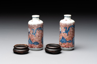 A pair of Chinese blue, white and copper-red 'mythical beasts' and a famille rose 'grasshopper' snuff bottle, Yongzheng and Daoguang mark, 19th C.
