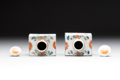 A pair of Chinese famille verte rectangular tea caddies and covers with fighting roosters, Kangxi