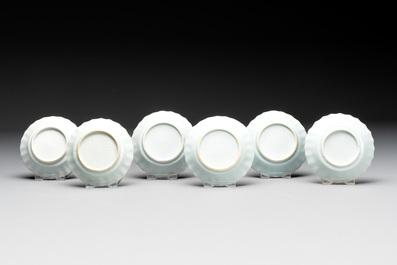 Eight Chinese blue and white cups, 14 saucers and four teapots, Kangxi/Qianlong