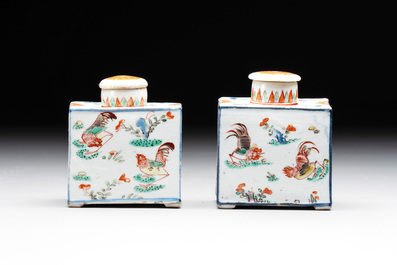 A pair of Chinese famille verte rectangular tea caddies and covers with fighting roosters, Kangxi
