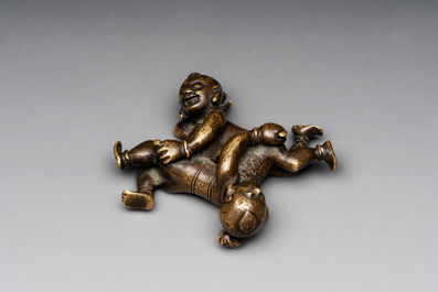 A Chinese bronze scroll weight in shape of two boys, Qing