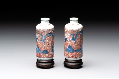 A pair of Chinese blue, white and copper-red 'mythical beasts' and a famille rose 'grasshopper' snuff bottle, Yongzheng and Daoguang mark, 19th C.