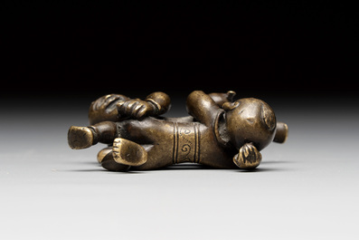A Chinese bronze scroll weight in shape of two boys, Qing