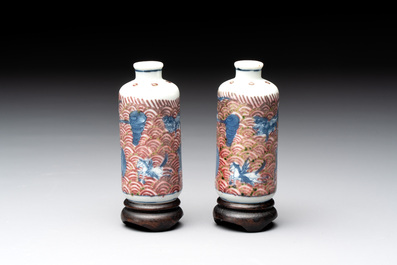 A pair of Chinese blue, white and copper-red 'mythical beasts' and a famille rose 'grasshopper' snuff bottle, Yongzheng and Daoguang mark, 19th C.