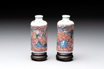 A pair of Chinese blue, white and copper-red 'mythical beasts' and a famille rose 'grasshopper' snuff bottle, Yongzheng and Daoguang mark, 19th C.