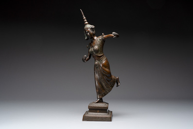 A large Vietnamese copper- and silver-inlaid bronze sculpture of a dancer, Bien Hoa school, early 20th C.
