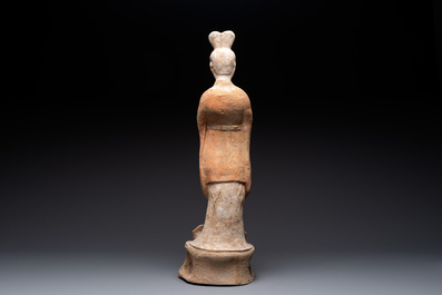 A large Chinese painted pottery figure of a civil official, Tang