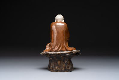 A Chinese brown- and caf&eacute;-au-lait-glazed Luohan, Zeng Longsheng 曾龍升 mark, 20th C.
