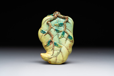 Two Chinese famille rose 'erotic' snuff bottles and a leaf-shaped saucer, 19th C.