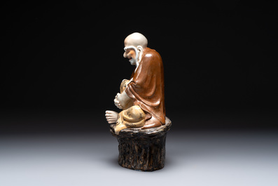 A Chinese brown- and caf&eacute;-au-lait-glazed Luohan, Zeng Longsheng 曾龍升 mark, 20th C.