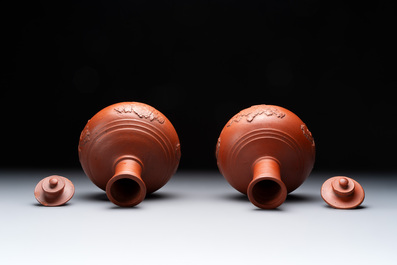 A pair of Yixing-style 'phoenix' bottle vases and covers, possibly England, 18th C.