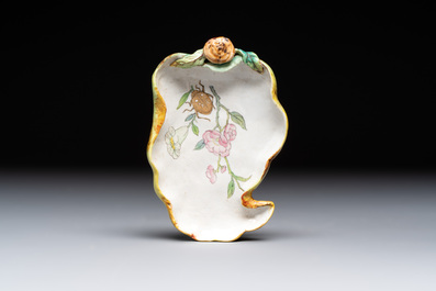 Two Chinese famille rose 'erotic' snuff bottles and a leaf-shaped saucer, 19th C.