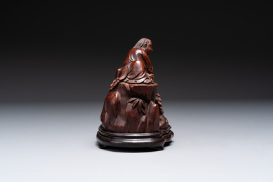 A fine Chinese carved bamboo group with Liuhai on wooden stand, 19th C.