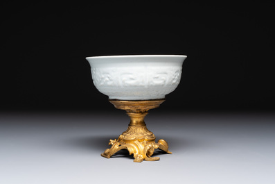 A Chinese white-glazed 'anhua' 'chilong' bowl on gilt bronze stand, 18/19th C.