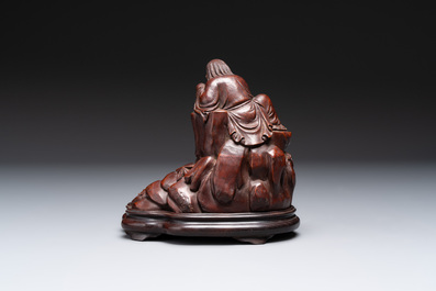 A fine Chinese carved bamboo group with Liuhai on wooden stand, 19th C.