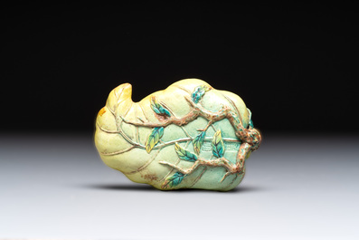 Two Chinese famille rose 'erotic' snuff bottles and a leaf-shaped saucer, 19th C.