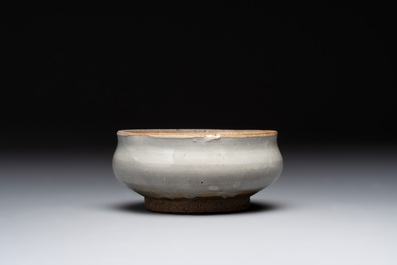 A Chinese 'jun' bowl and a Dehua blanc de Chine group with Guanyin, Ming/Qing