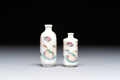 Two Chinese famille rose 'erotic' snuff bottles and a leaf-shaped saucer, 19th C.