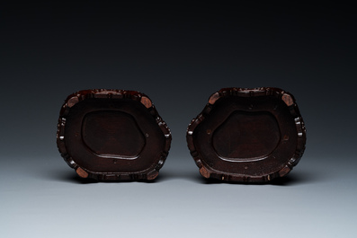 A pair of Chinese verte biscuit vases resting on Buddhist lions, Kangxi