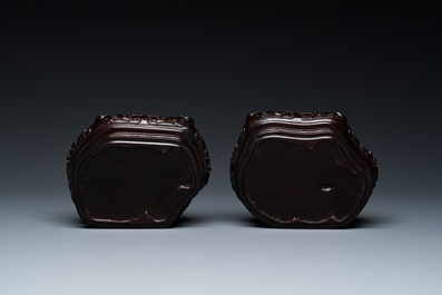 A pair of Chinese verte biscuit vases resting on Buddhist lions, Kangxi