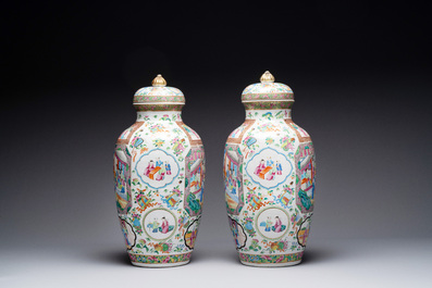 A pair of Chinese Canton famille rose vases and covers with narrative design, 19th C.