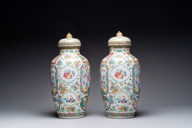 A pair of Chinese Canton famille rose vases and covers with narrative design, 19th C.