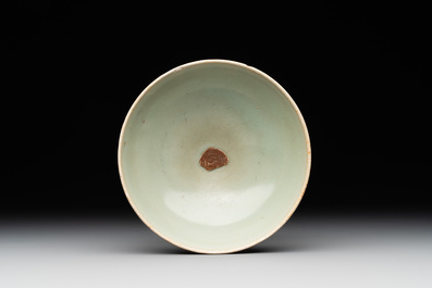 A Chinese Longquan celadon 'lotus' bowl and a large green-glazed jar, Ming and later