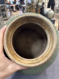A Chinese Longquan celadon 'lotus' bowl and a large green-glazed jar, Ming and later
