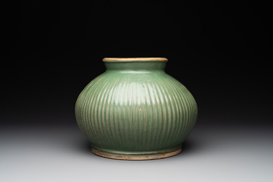 A Chinese Longquan celadon 'lotus' bowl and a large green-glazed jar, Ming and later