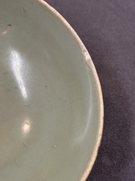 A Chinese Longquan celadon 'lotus' bowl and a large green-glazed jar, Ming and later