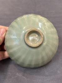 A Chinese Longquan celadon 'lotus' bowl and a large green-glazed jar, Ming and later