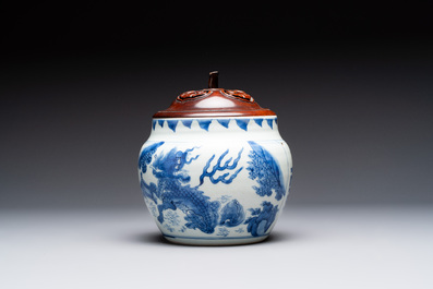 A Chinese blue and white 'qilin' jar and wooden cover, Transitional period