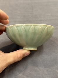 A Chinese Longquan celadon 'lotus' bowl and a large green-glazed jar, Ming and later