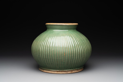 A Chinese Longquan celadon 'lotus' bowl and a large green-glazed jar, Ming and later