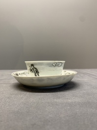 A Chinese grisaille and gilt-decorated 'European subject' cup and saucer, Qianlong
