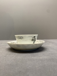 A Chinese grisaille and gilt-decorated 'European subject' cup and saucer, Qianlong