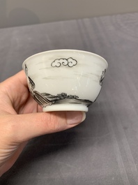 A Chinese grisaille and gilt-decorated 'European subject' cup and saucer, Qianlong
