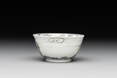 A Chinese grisaille and gilt-decorated 'European subject' cup and saucer, Qianlong