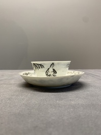 A Chinese grisaille and gilt-decorated 'European subject' cup and saucer, Qianlong