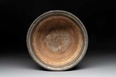 A tinned copper 'kashkul' or begging bowl, a calligraphic bowl and a brass covered jar, Iran, 18/19th C.