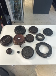 A collection of 11 Chinese wooden stands, 19/20th C.