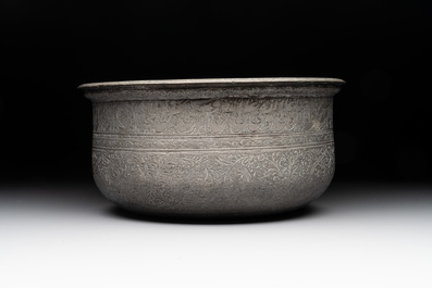 A tinned copper 'kashkul' or begging bowl, a calligraphic bowl and a brass covered jar, Iran, 18/19th C.