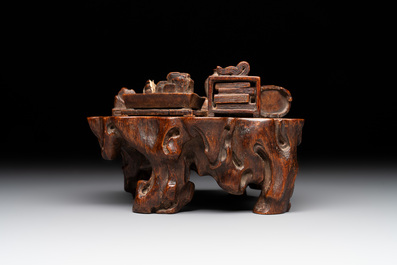 A Chinese agarwood carving of a miniature table with antiquities, 18/19th C.