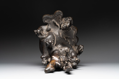 A rare Chinese bronze group depicting two immortals and various animals in a mountainous landscape, Ming