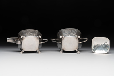 A Chinese silver covered teapot, sugar jar and milk jug with bamboo design, Tackhing 90% silver mark, 20th C.