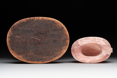 A large Chinese rose quartz vase and cover on a wooden stand, 20th C.